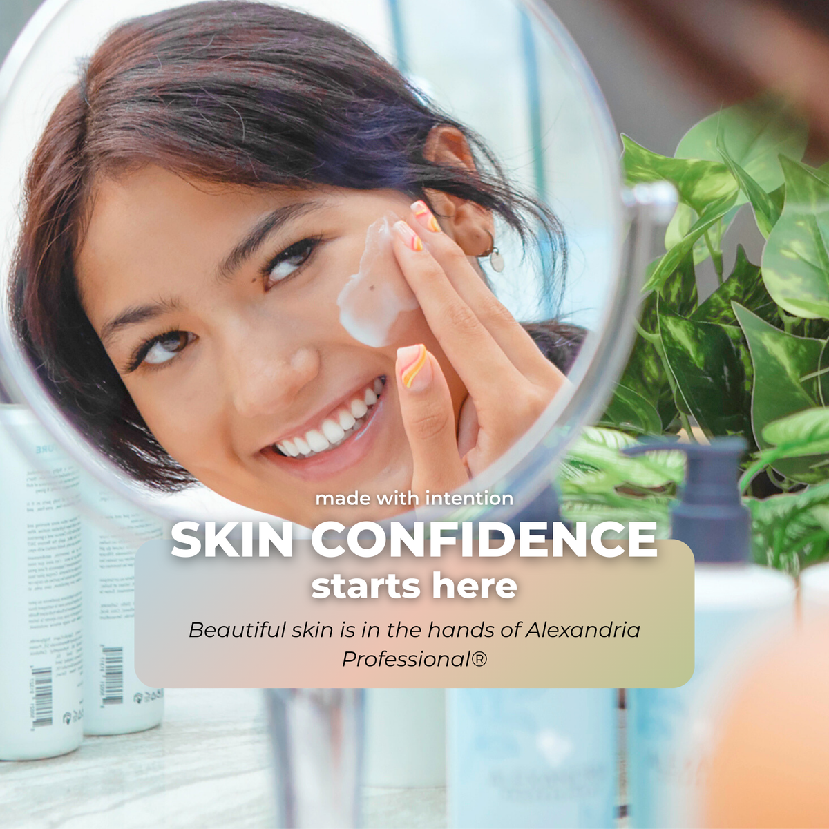 model applying Restore 24/7 Moisture Lotion to her cheek, looking into a mirror with blurred products in the background and text overlay saying "made with intention. Skin confidence starts here. Beautiful skin is in the hands of Alexandria Professional."